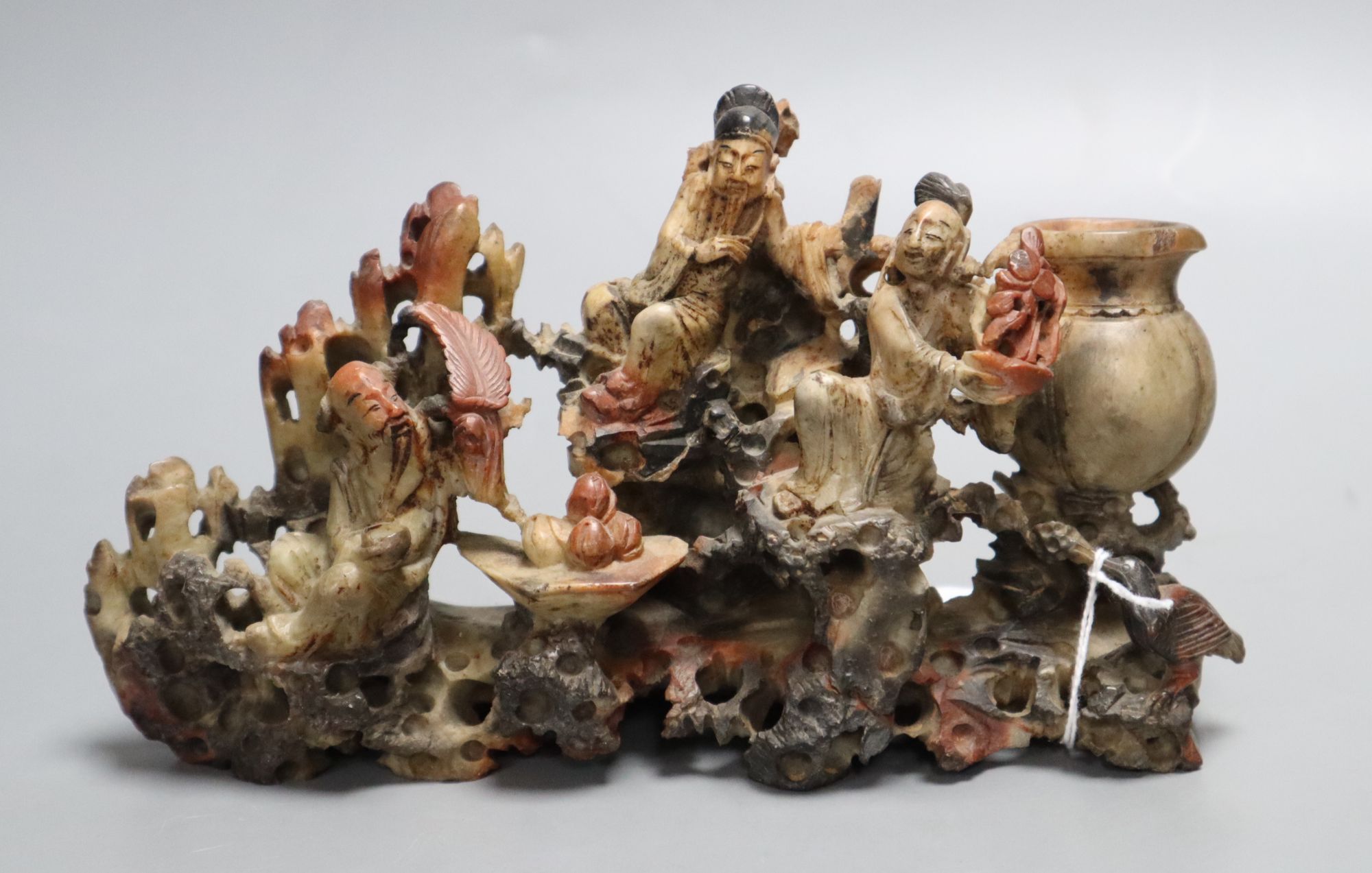 A Chinese soapstone carving of immortals, early 20th century, length 21cm